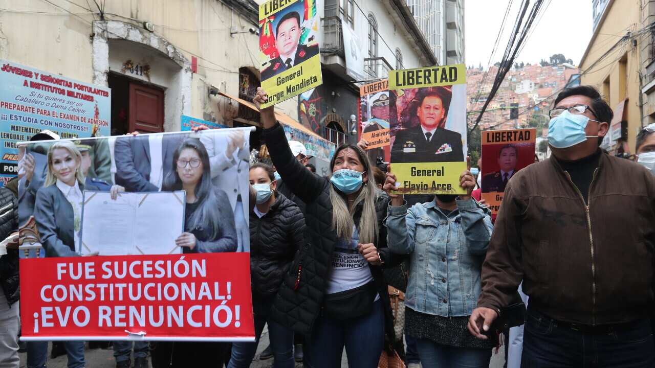 Carolina Ribera (c), daughter of the former interim president of Bolivia, Jeanine Anez, participates in a sit-in in front of the First Anti-Corruption Sentencing Court