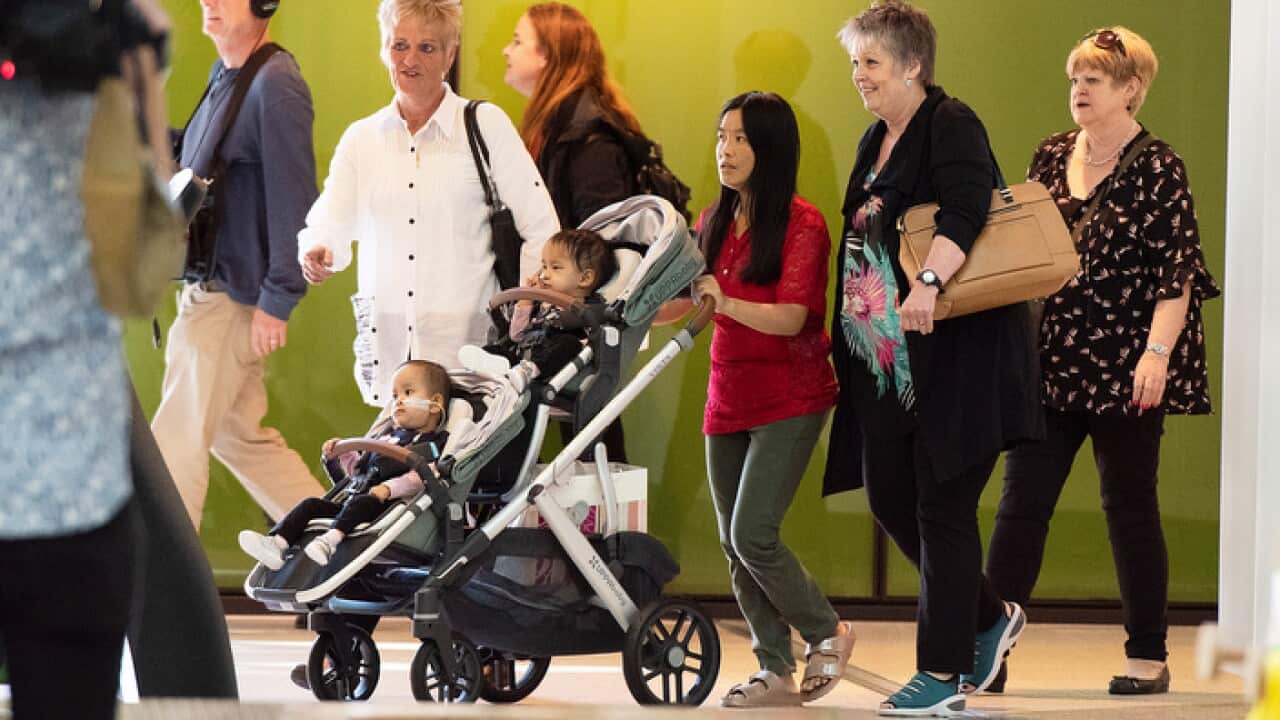 Twins Nima and Dawa with their mother Bhumchu Zangmo upon being discharged from the Royal Childrens Hospital in Melbourne