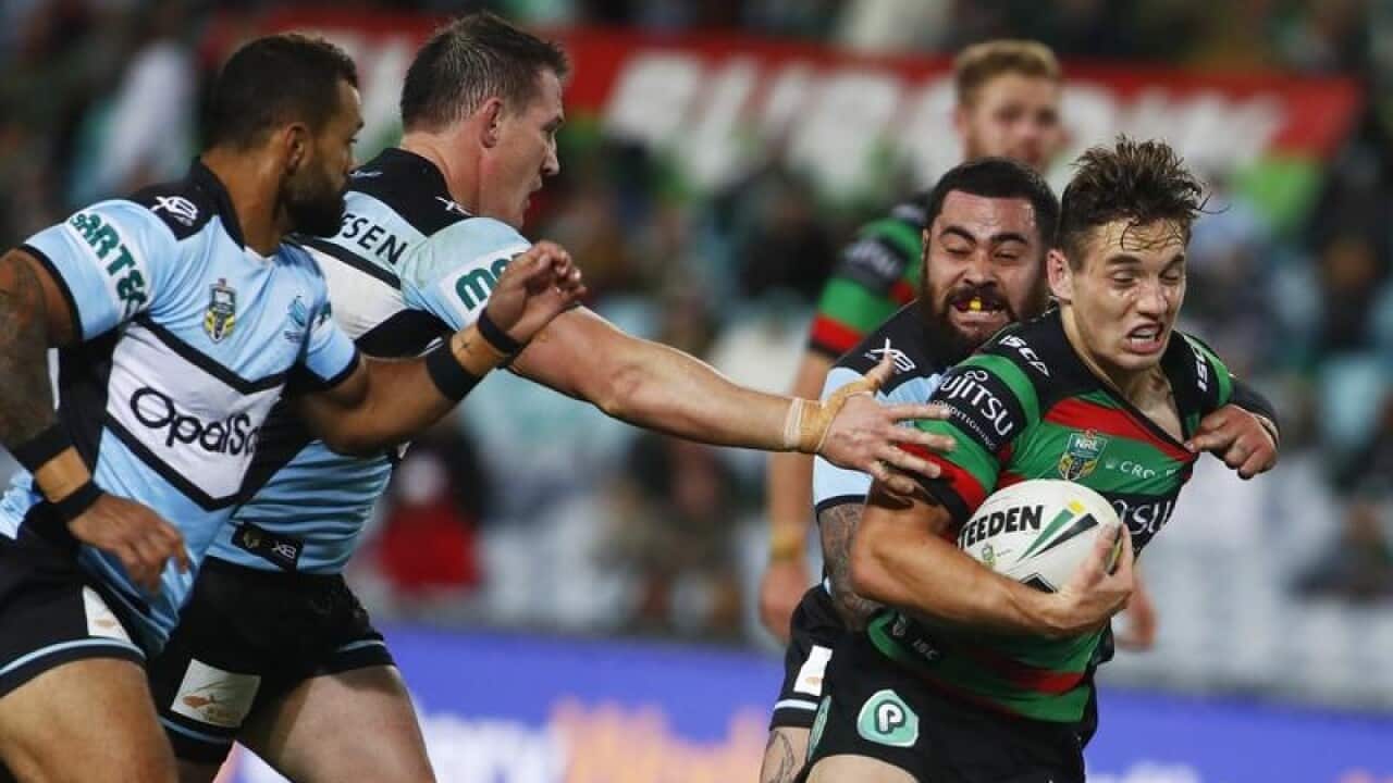 Cameron Murray of the Rabbitohs makes a break against Cronulla.
