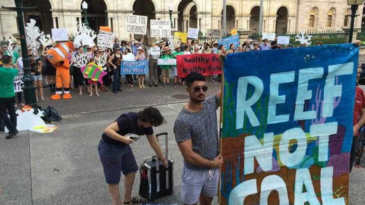 More than 100 protesters gather outside Queensland's parliament in Brisbane on Monday, April 4, 2016