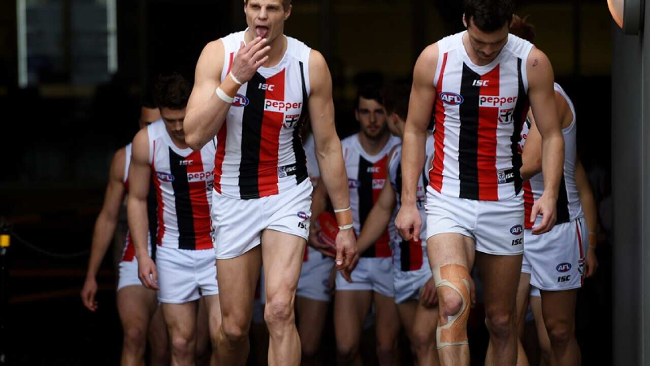 Nick Riewoldt of the Saints leads the team