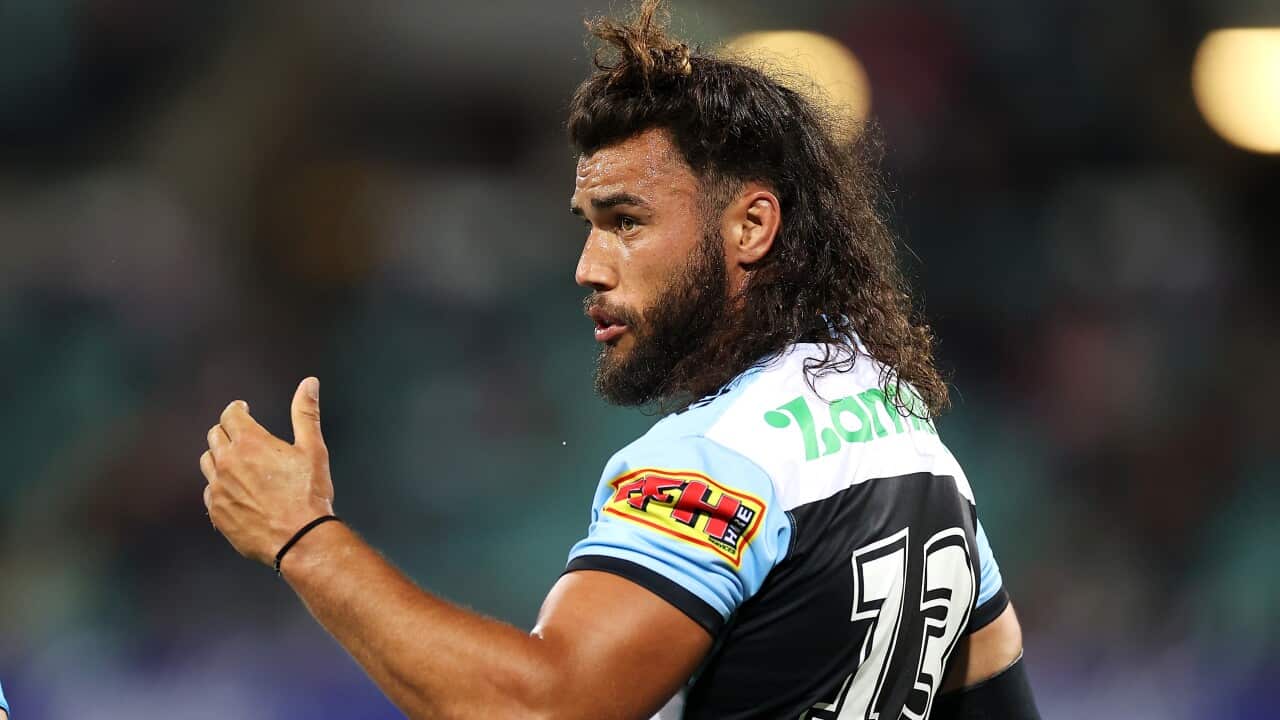 A male rugby player mid-match.