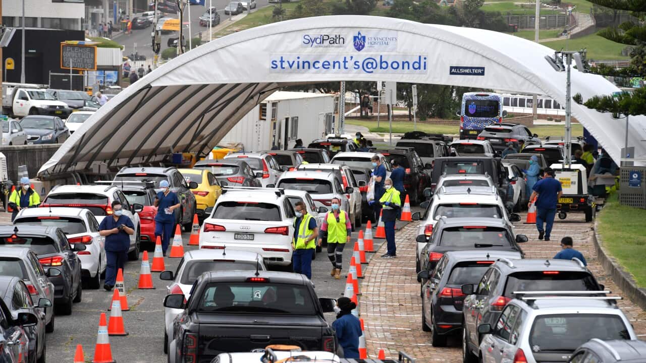 Members of the public queue for Covid19 PCR tests at a clinic at Bondi Beach in Sydney, Monday, December 27, 2021. A spiralling outbreak of COVID-19 is swamping contact tracers, overwhelming testing sites and affecting flight schedules as authorities rein