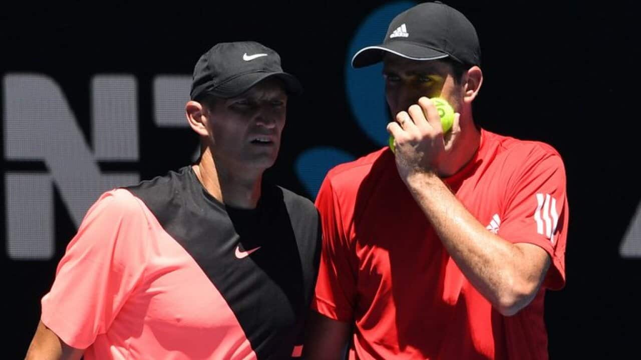 Max Mirnyi of Belarus and Philipp Oswald of Austria (right)in action against Bob Bryan and Mike Bryan of the United States during round two on day five of the Australian Open tennis tournament, in Melbourne, Friday, January 19, 2018
