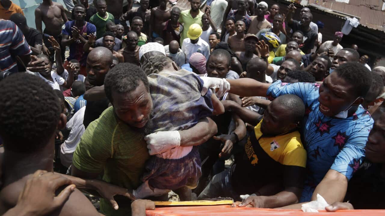 A child is rescued from the rubble of a collapsed building in Lagos, Nigeria.