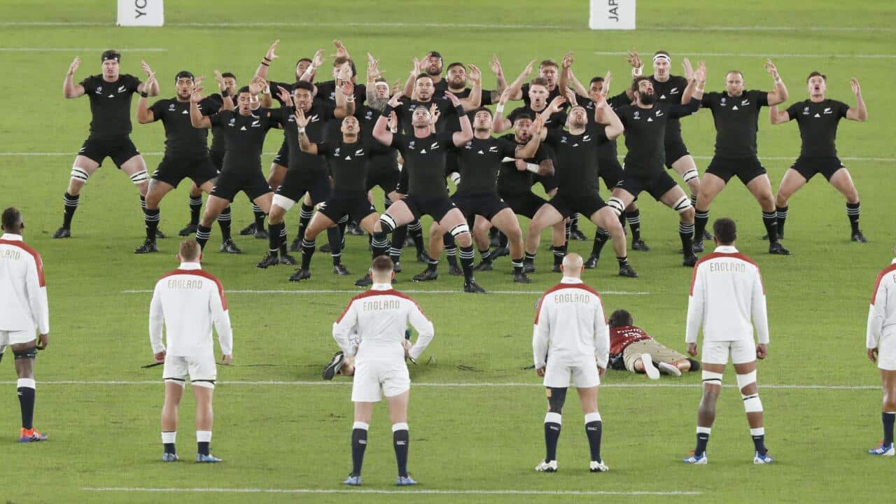 England players (front) watch the New Zealand squad performing the haka prior to a Rugby World Cup semifinal on Oct. 26, 2019, in Yokohama, near Tokyo. (Kyodo via AP Images) ==Kyodo