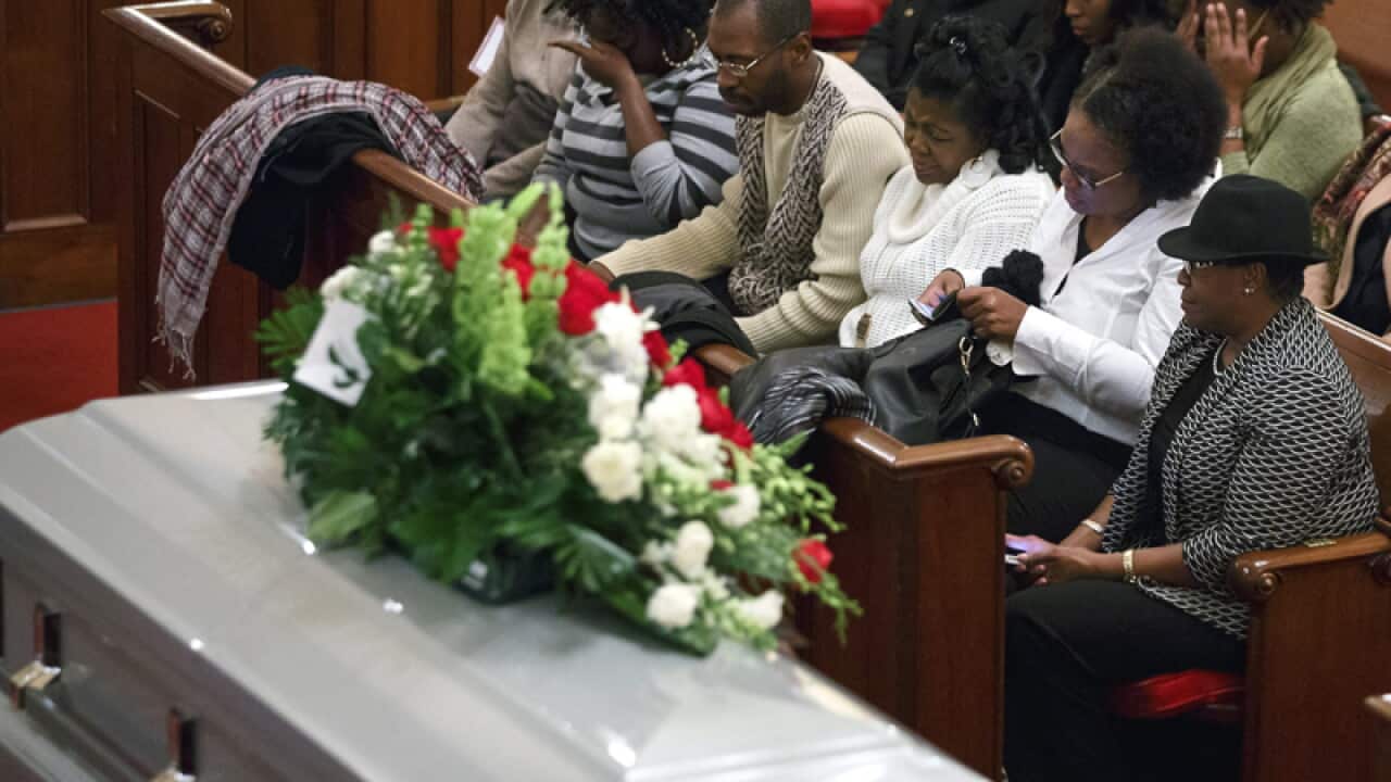 Relatives attend the funeral of Akai Gurley