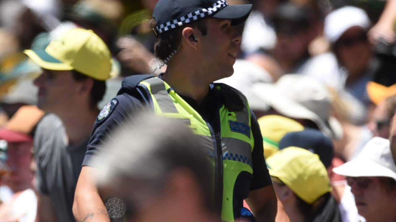 Victorian police watch the crowd