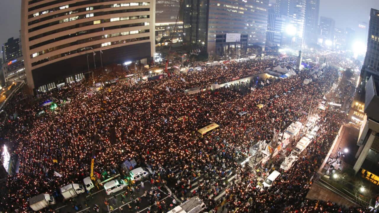 Protesters toward the presidential house in Seoul