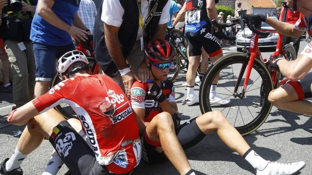 Richie Porte receives medical assistance after crashing.