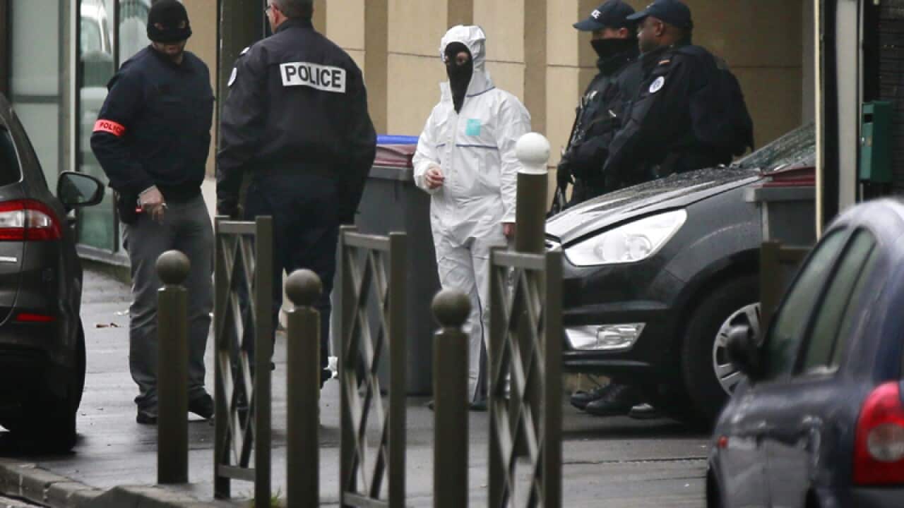 Police officers and investigators during an anti-terrorism operation