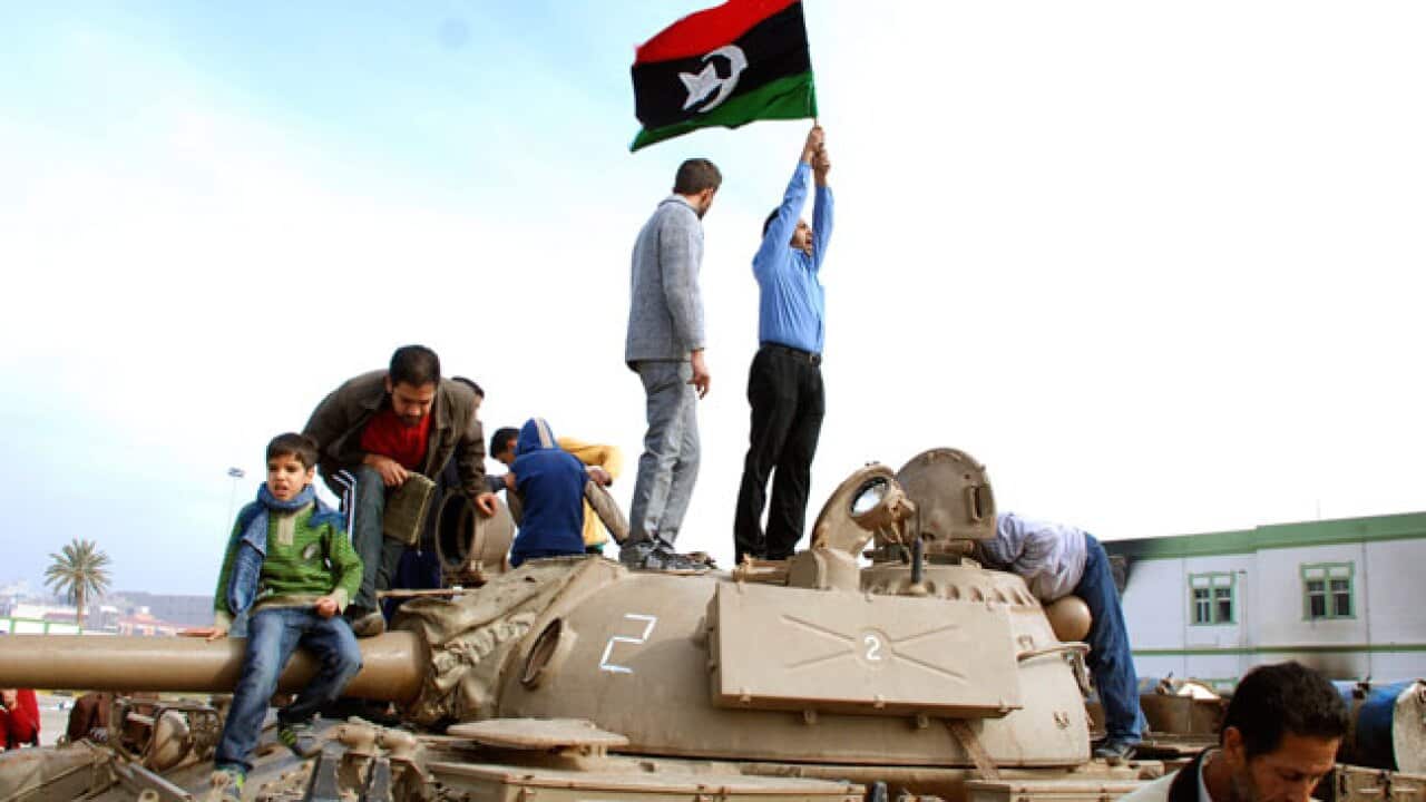 libya_protests_tank_flag_B_Getty_1054935086