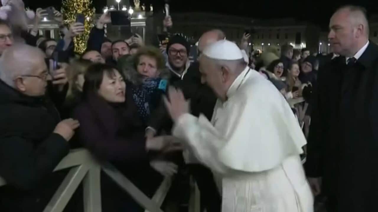 Pope Francis was unimpressed when a woman in the crowd grabbed his hand.  