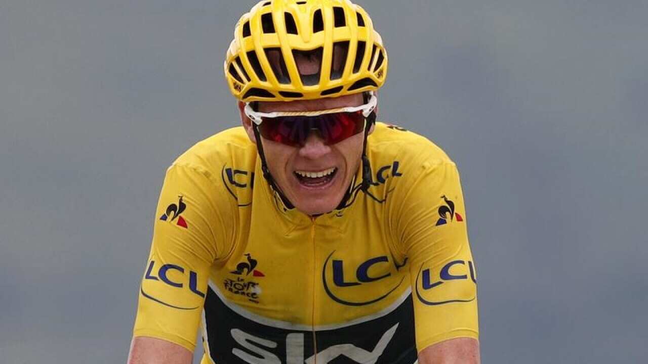 Britain's Chris Froome, wearing the overall leader's yellow jersey.