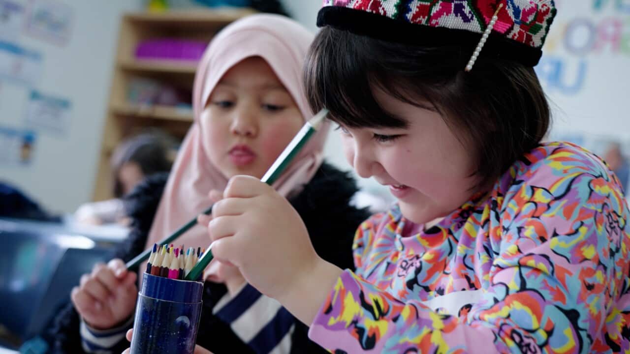 Two children in a classroom.