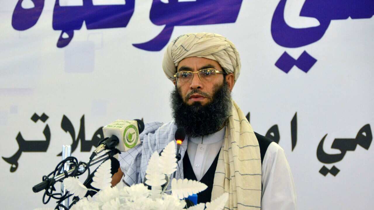 Man at table gives side eye.