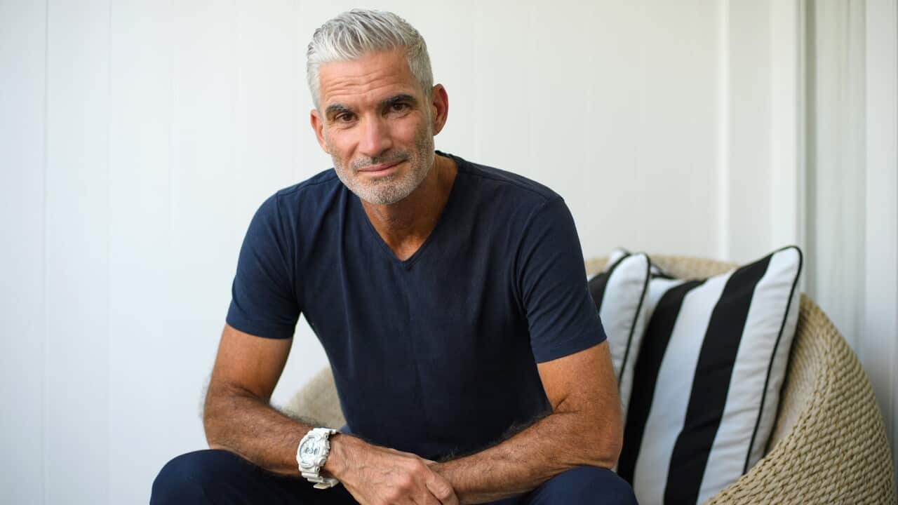 Former Socceroo Craig Foster poses for a portrait in a chair