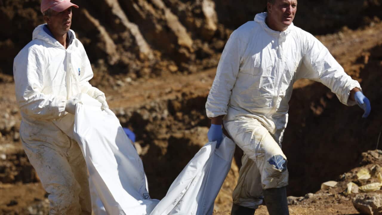 Forensic experts at a mass grave in Bosnia