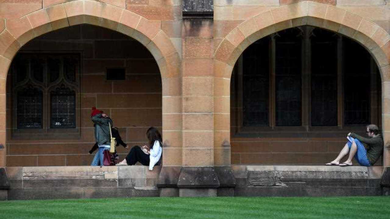 Students read at the Quadrangle of the University of Sydney in Sydney on Tuesday, May 2, 2017.