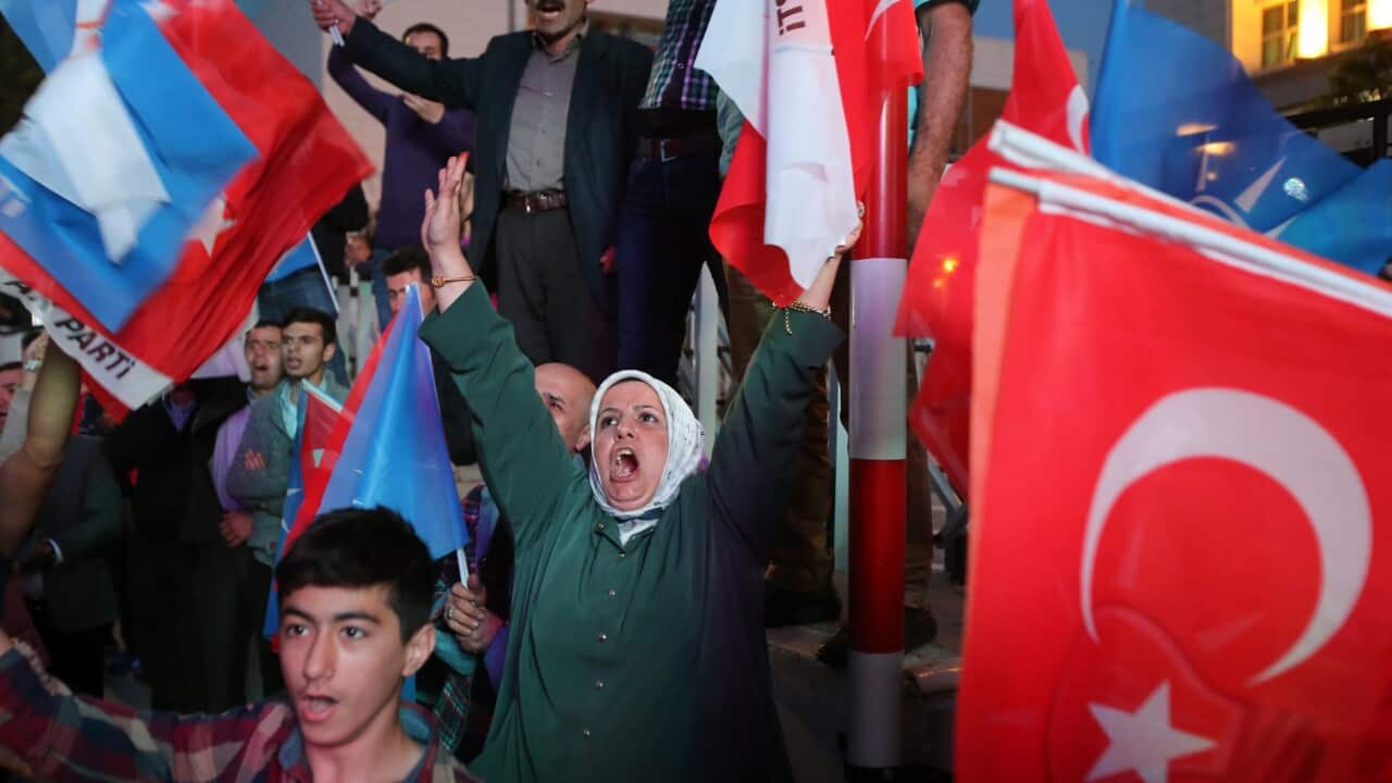 Supporters of Turkey's ruling Justice and Development Party (AKP) wait for Turkish Prime Minister Ahmet Davutoglu (not pictured) in front of the party's headquarter in Ankara, Turkey 07 June 2015. (EPA/DEPO PHOTOS)