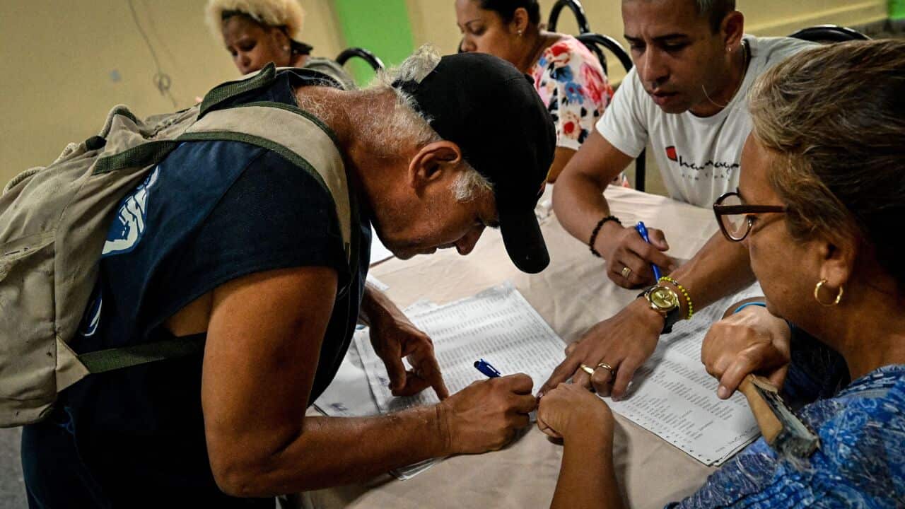 A man votes at a polling station during the new Family Code referendum.