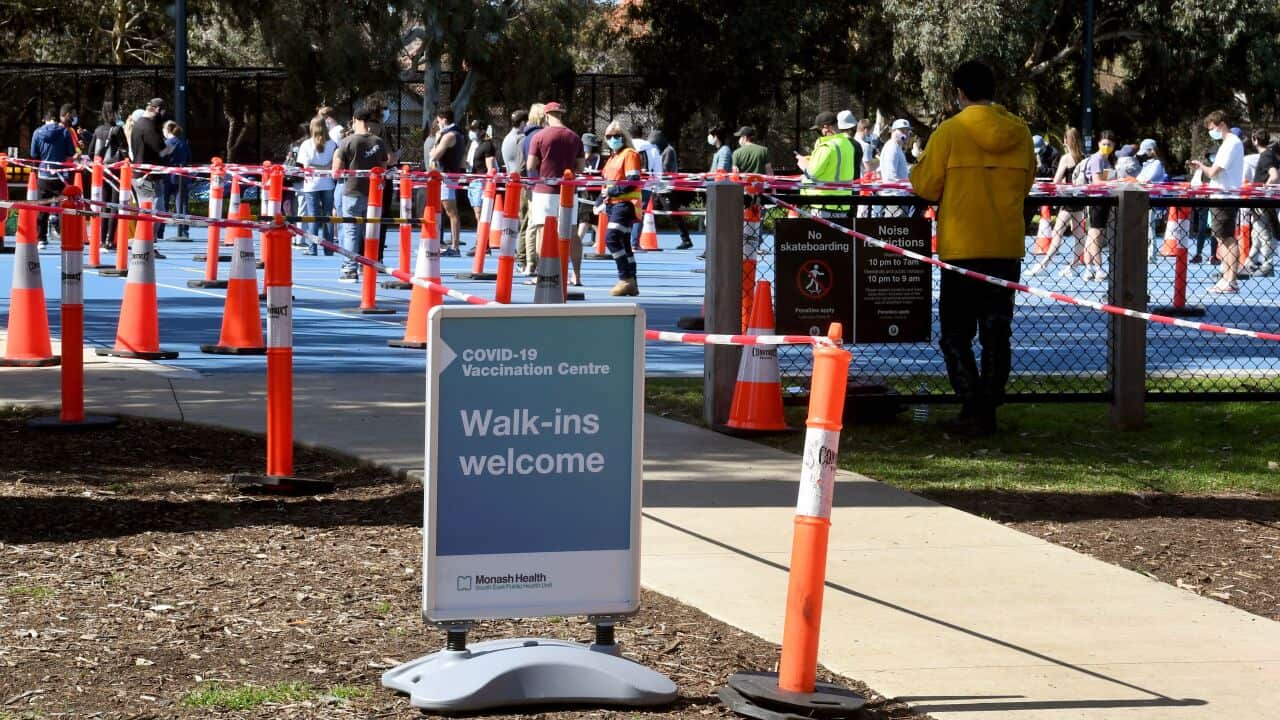 People queue at a Covid-19 vaccination centre in Melbourne