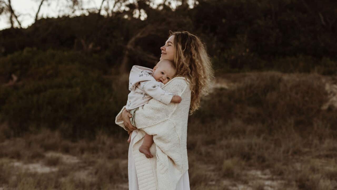 Iveta holding her baby girl