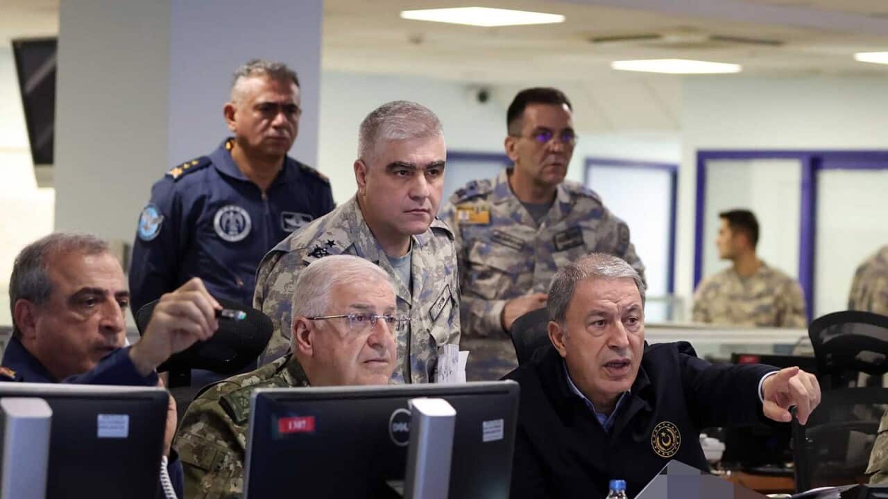 Turkish Defence Minister Hulisi Akar (bottom R) watching the progress of the air strikes