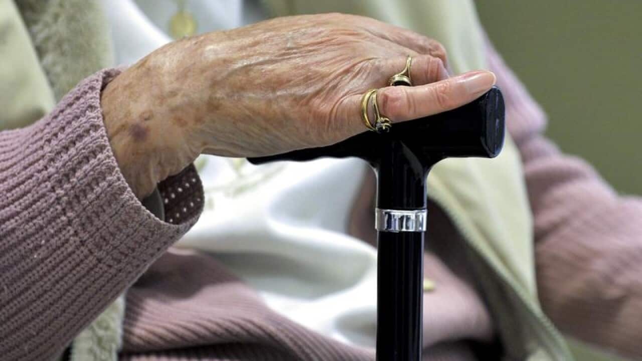 An elderly woman.