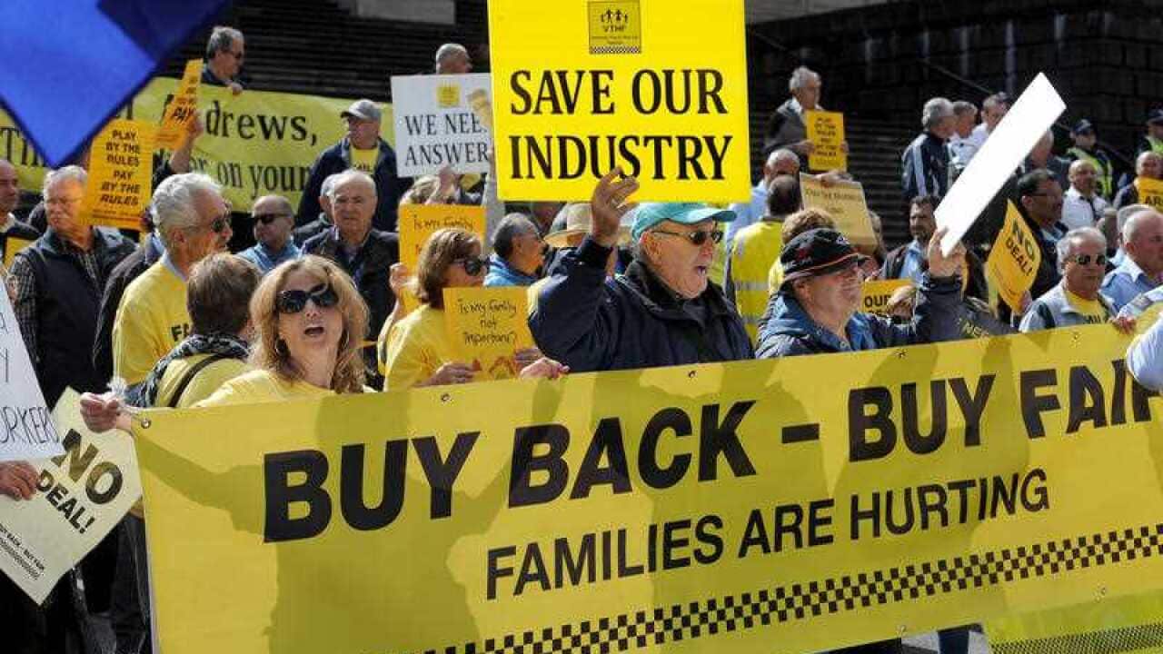 Taxi drivers protest outside Parliament house in Melbourne over Government deregulation plans for the Taxi industry