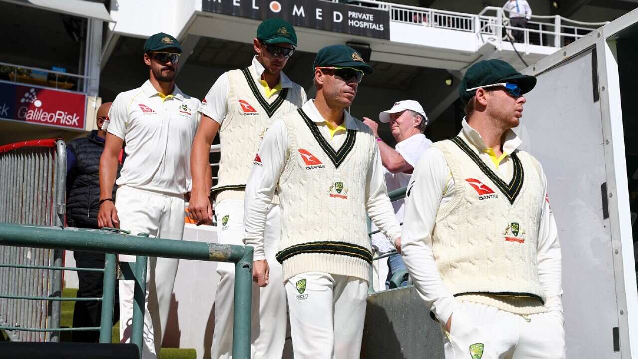 Steve Smith of Australia (r) and David Warner of Australia (c) during Day 4 of the Sunfoil International Test Series cricket match between South Africa and Australia at Newlands Cricket Ground, Cape Town.
