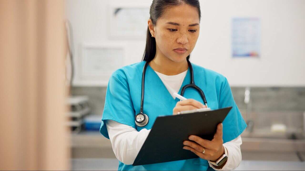 Asian woman, vet and writing with clipboard for results on animal medicine, study or diagnosis at clinic. Young female person or veterinarian taking notes for medical prescription or pet treatment