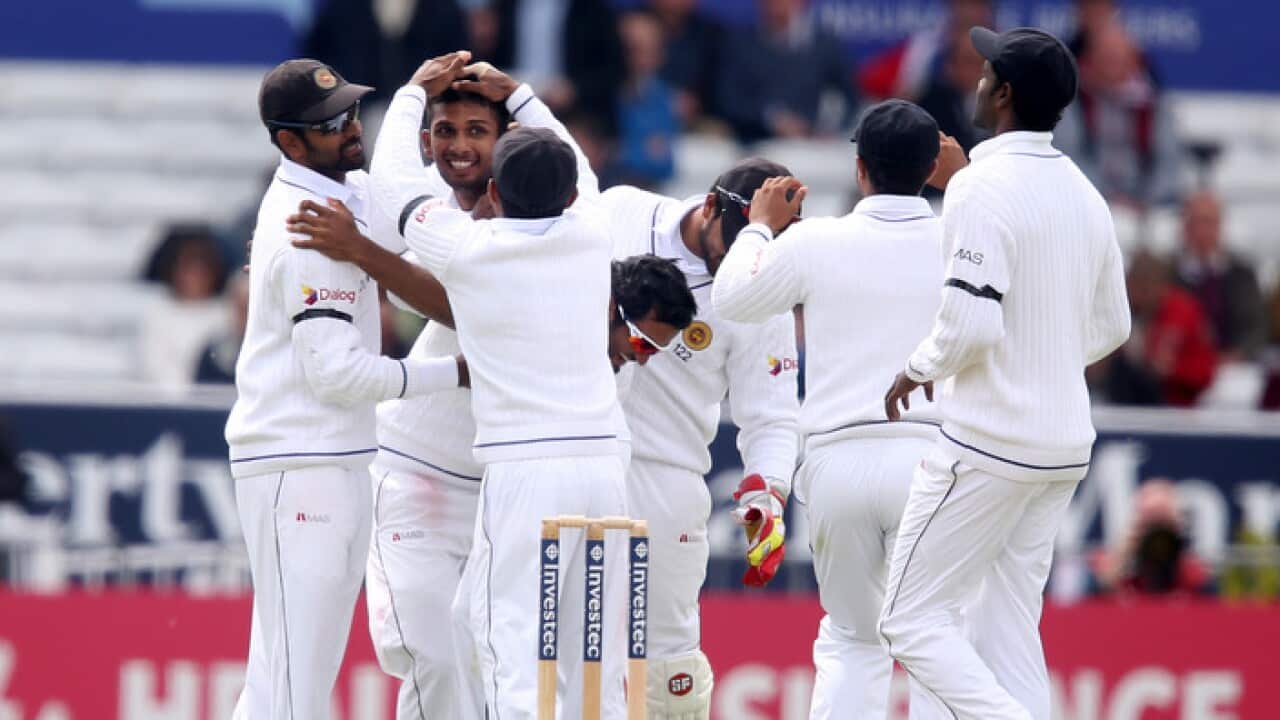 Sri Lanka's Dasun Shanaka (second left) celebrates with team-mates after taking the wicket of England's Alastair Cook during day one