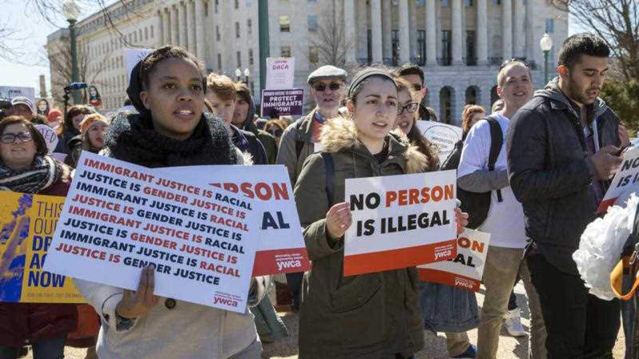 Deferred Action for Childhood Arrivals (DACA) recipients and other young immigrants march with supporters as they arrive at the Capitol in Washington.