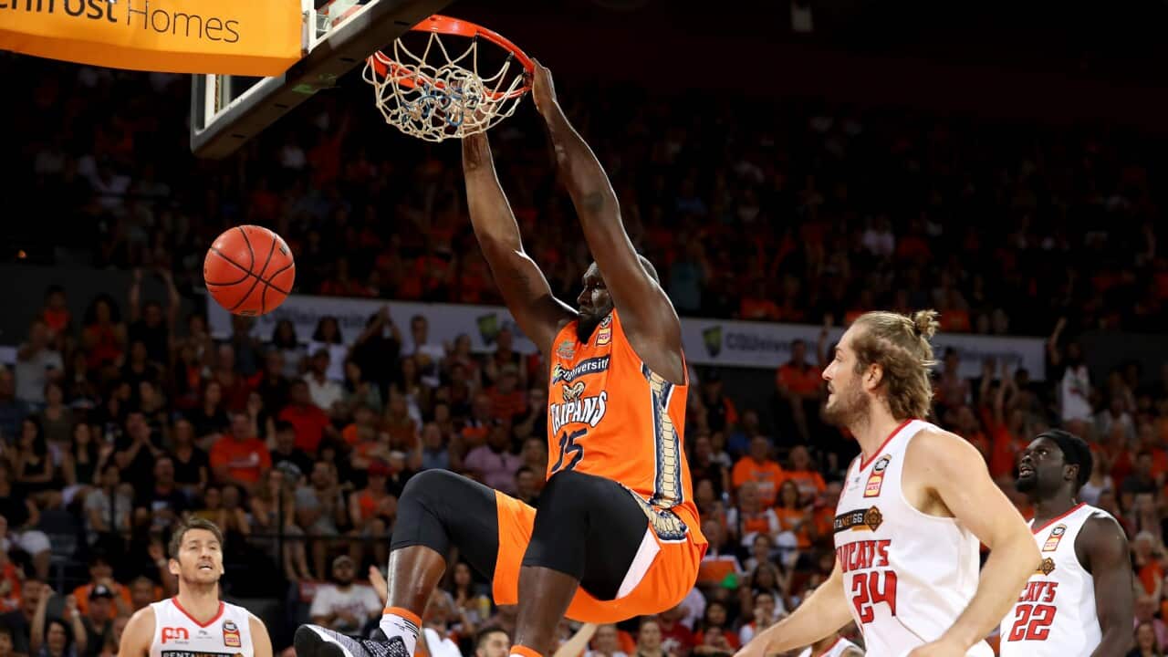 Nathan Jawai slam dunks for the Taipans as Cairns hits back to level semi-final series with the Perth Wildcats