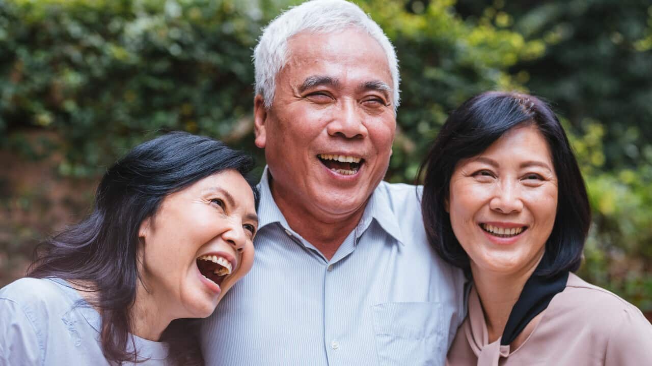 Group of seniors enjoying discussion at park
