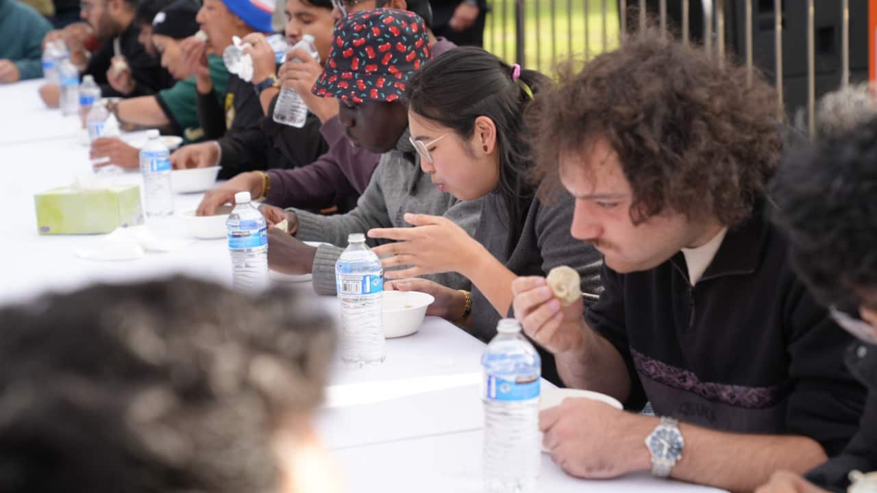 Participants take part in a Momo competition at the Momo Festival Melbourne 2026, held at Footscray Park.