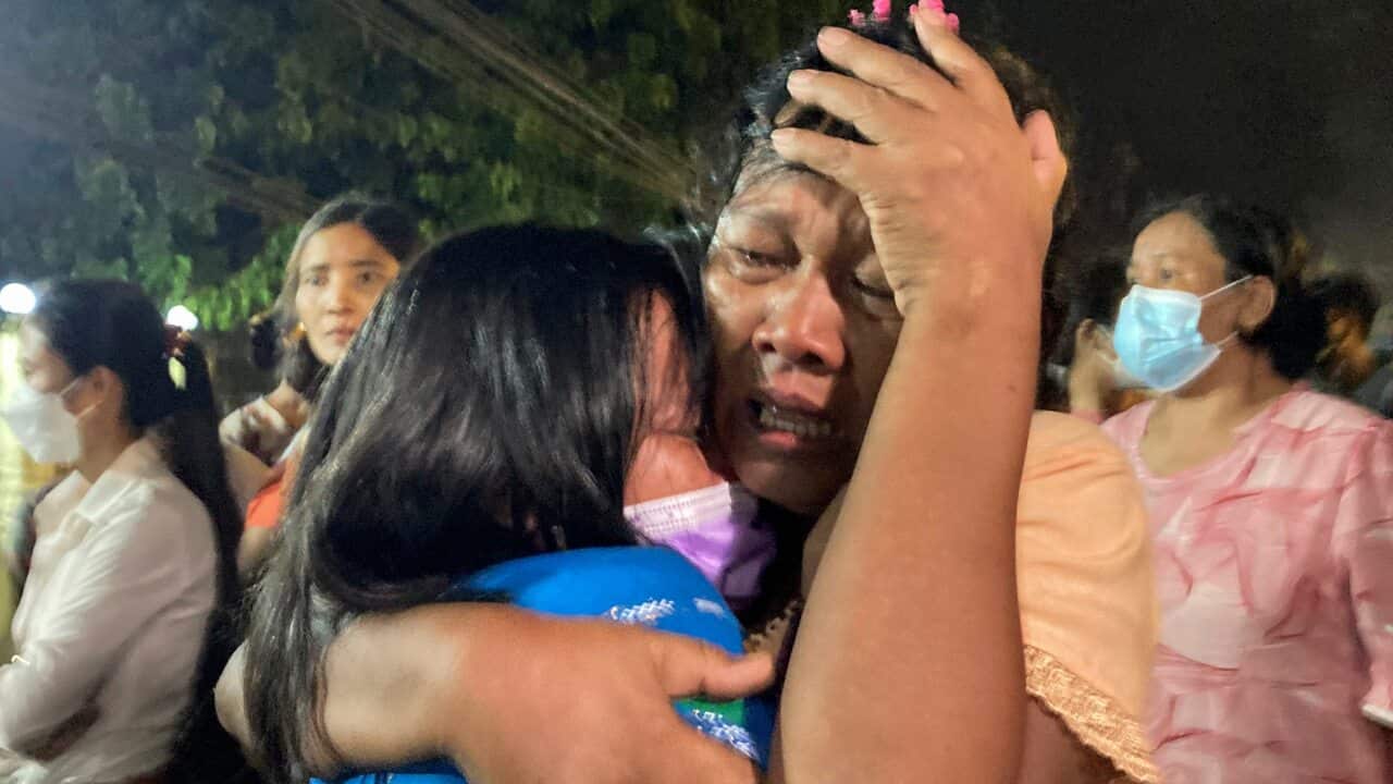 A mother reacts after her daughter, left, was released from Insein Prison in Yangon, Myanmar, Monday, Oct. 18, 2021