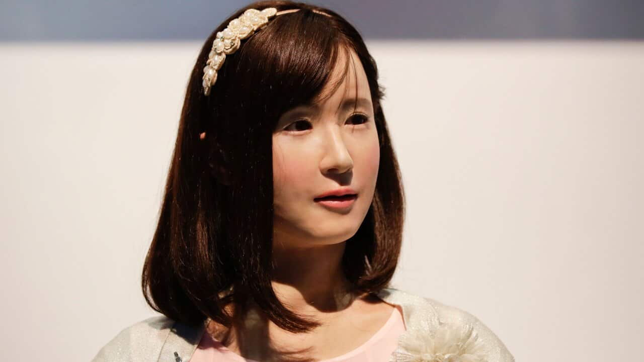 A robot named ChihiraAico interacts with attendees at the Toshiba booth at the International CES.