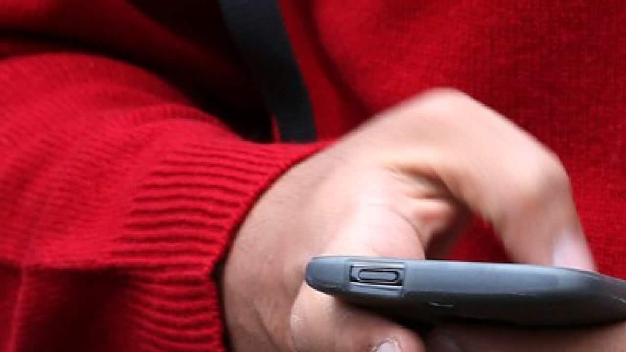 A person uses a mobile phone