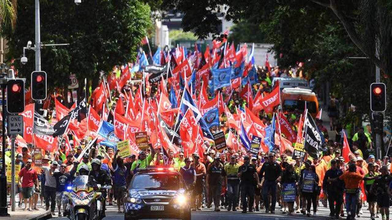 Workers are seen during a union protest against the slashing of penalty rates and the Federal Government's tough new building code in Brisbane
