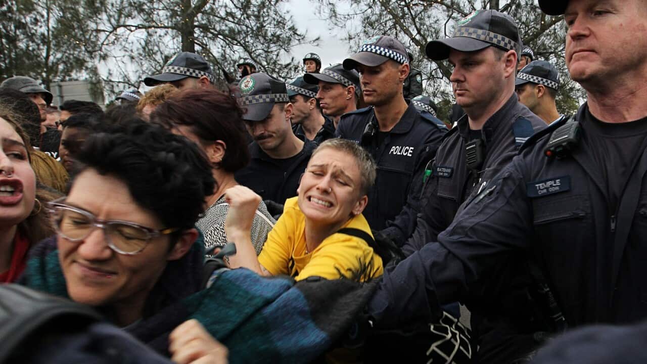 Supporters of British alt-right commentator Milo Yiannopoulos clash with left-wing protesters in Lilyfield, Sydney, on Tuesday, December 5, 2017.