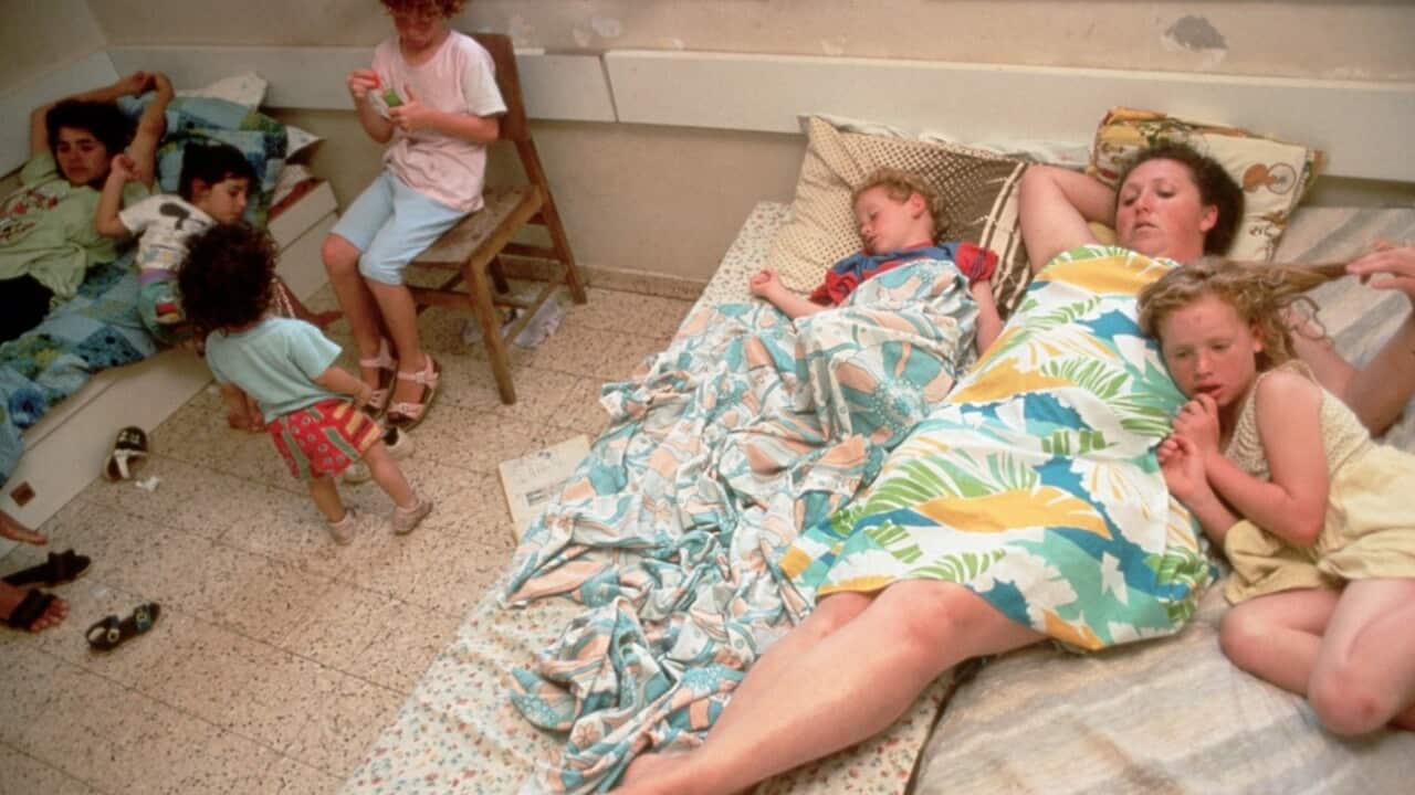 A mother and her children at a shelter for victims of domestic violence.jpg