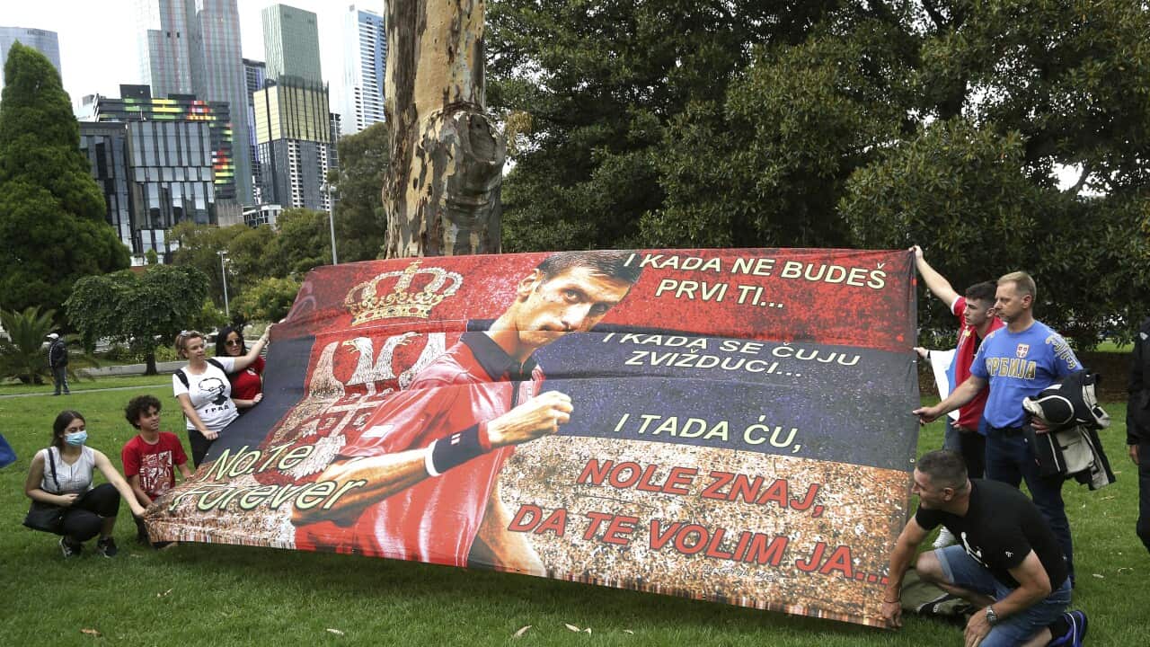Protestors outside the Park Hotel in the Melbourne suburb of Carlton ahead of the Australian Open in Melbourne where it is believed Serbia Novak Djokovic is currently being detained, Australia, Friday, Jan. 7, 2022. Djokovic had received the medical exemp