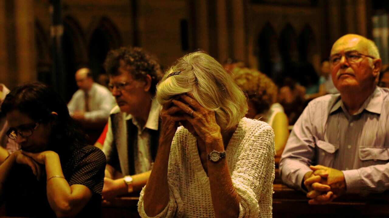 People pray in a church