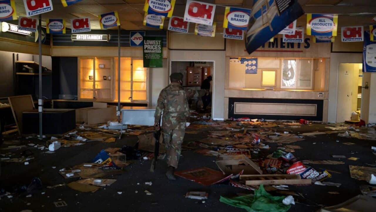 A South African National Defence Force (SANDF) soldier looks for looters at the Jabulani mall in Soweto on the outskirts of Johannesburg on 13 July, 2021.
