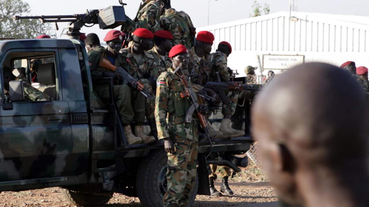 South Sudanese soldiers patrol a street in Juba