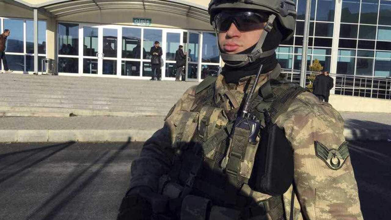 A paramilitary police officer stands at the entrance of Silivri Prison and Courthouse complex where 29 Turkish former police officers are on trial.