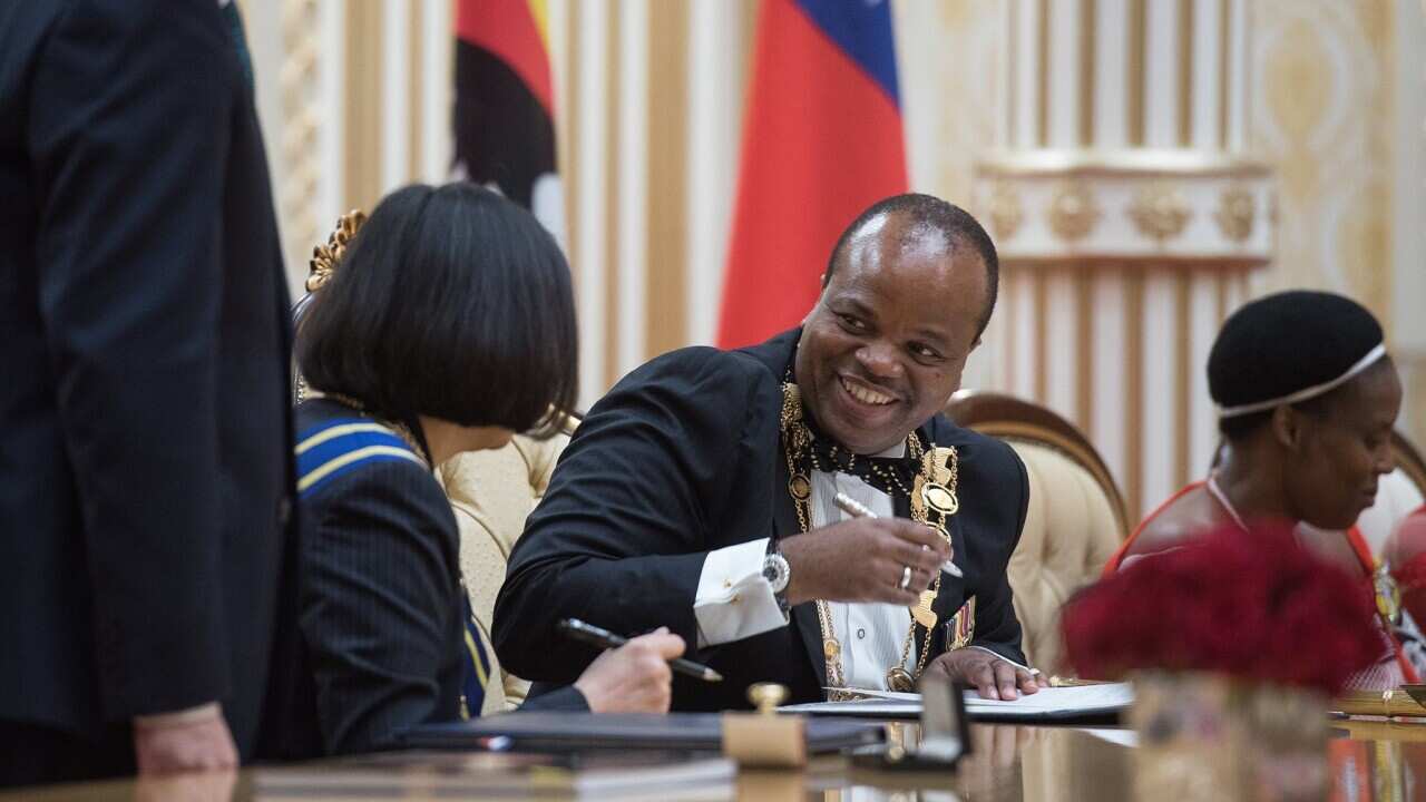 A handout photo made available by Taiwan's Presidential Office shows Swaziland King Mswati III (pictured centre).