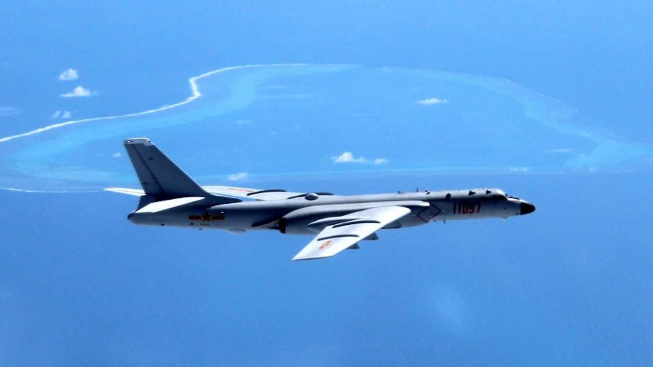 A Chinese H-6K bomber patrols the islands and reefs in the South China Sea.